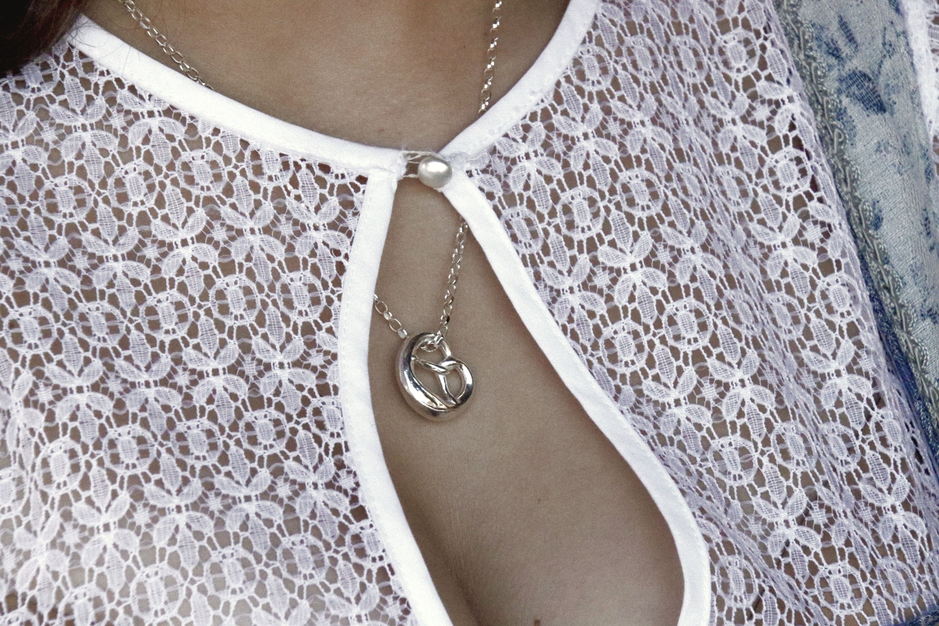 Silver heart pendant on model