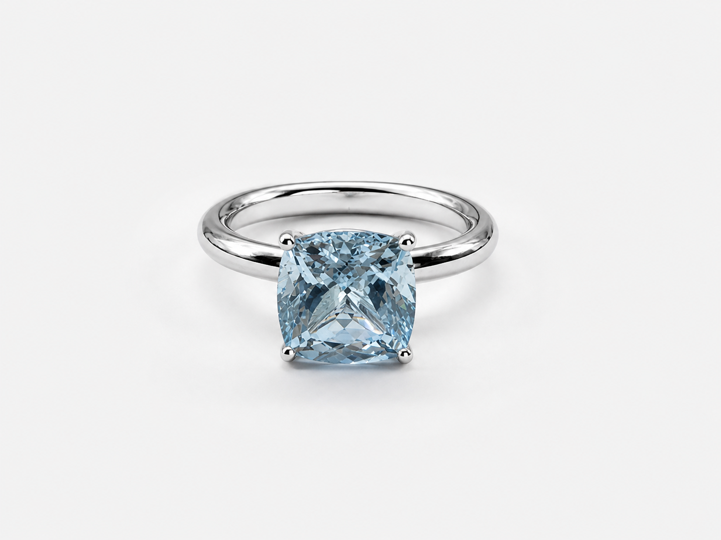 Ring with blue cushion-cut stone